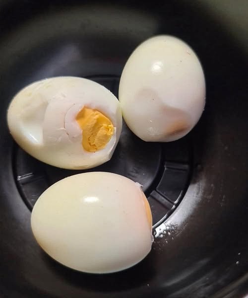 Why does a green ring appear around hard-boiled eggs?